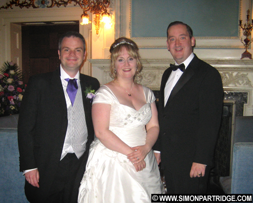 Bride and groom John and Emily with Simon Partridge
