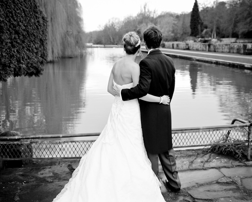 Laura and Graham by the lake at Coombe Abbey Hotel. Photo by Melbourne Photography
